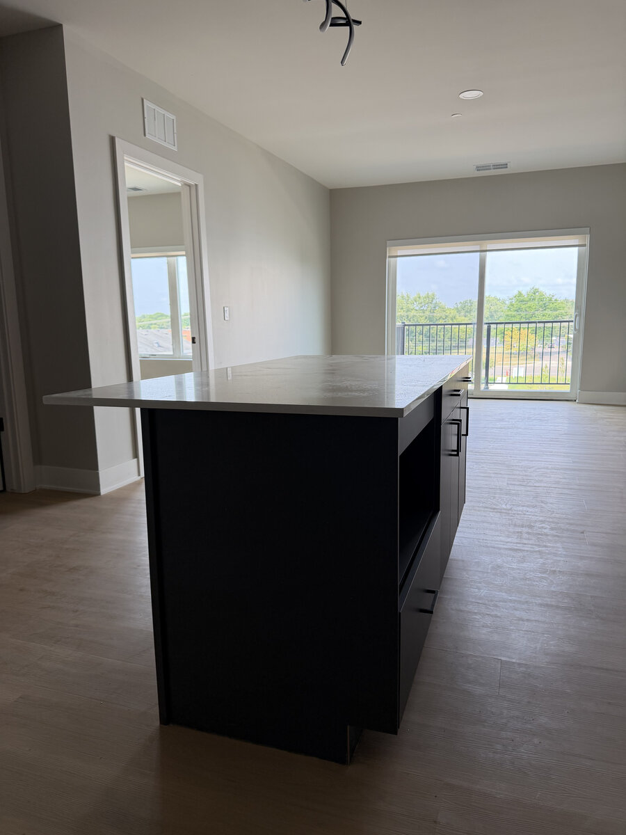 Installed quartz countertops in a multifamily kitchen